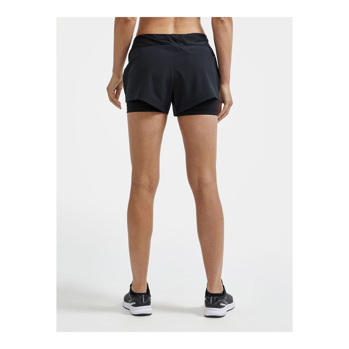 CRAFT ADV ESSENCE 2 EN 1 SHORT - FEMME
